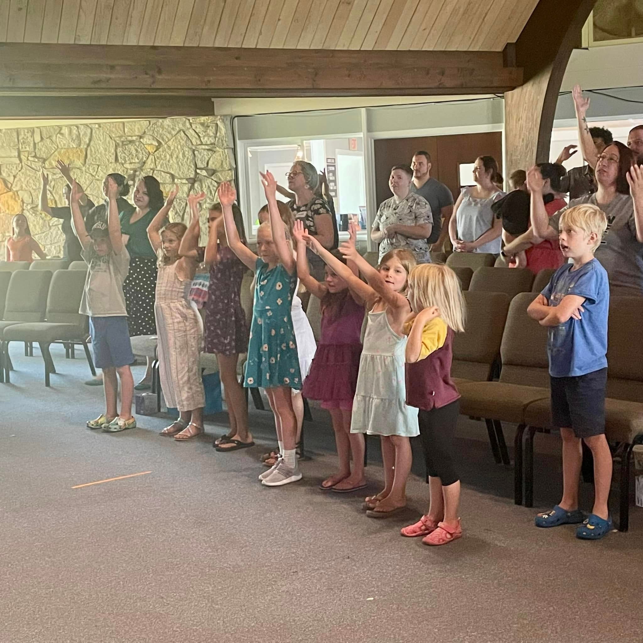 Kids worshiping at the front during a Sunday service